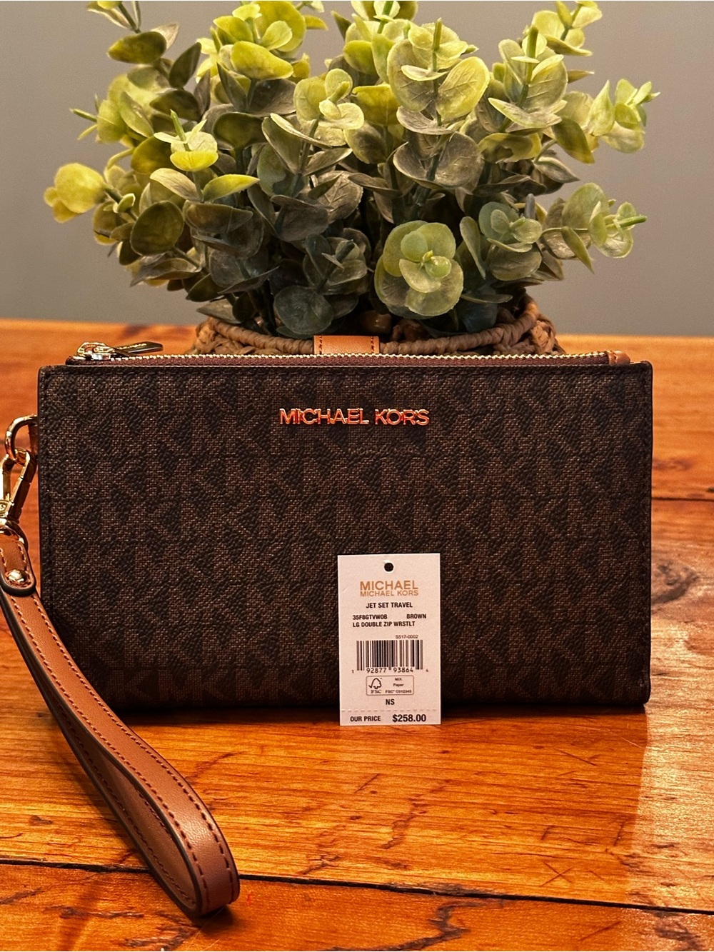Michael Kors Brown and Tan Signature Wristlet w/ phone pocket.